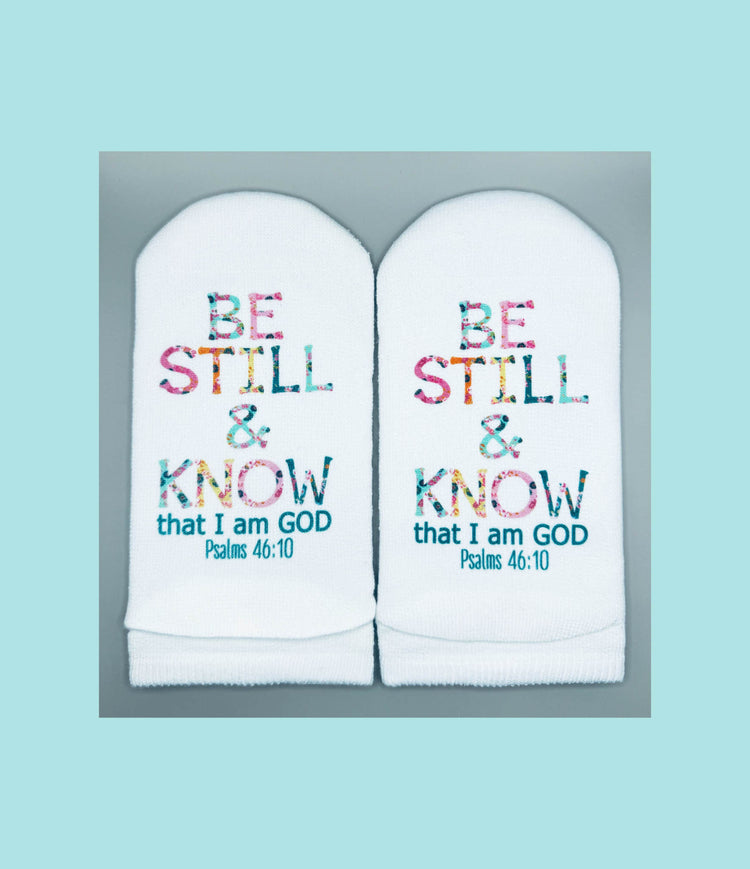 White women's no-show sock with floral letter print on top and Psalms verse text on the sole.