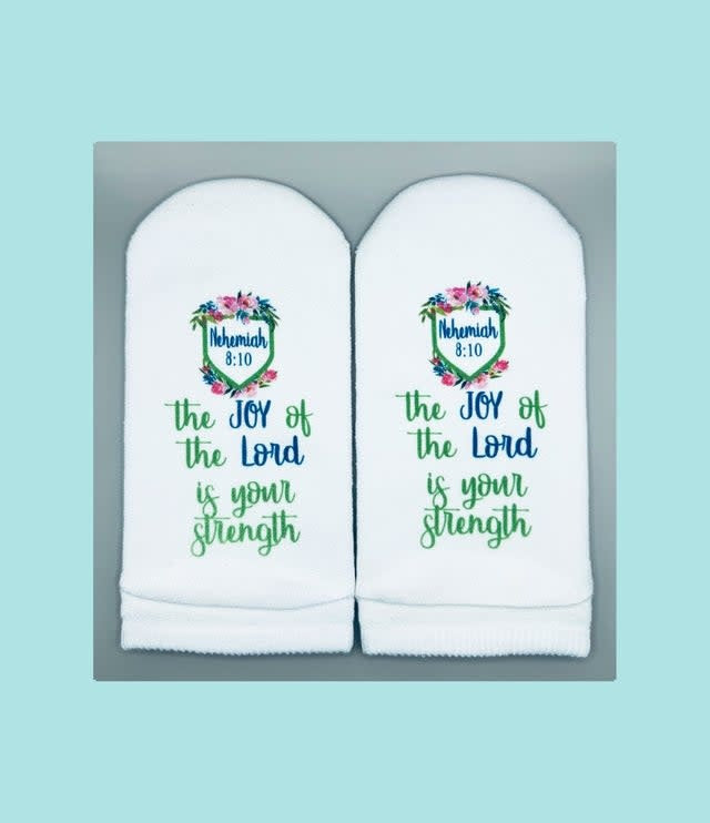 Women's No Show sock in black with white shield logo on sole featuring Nehemiah verse