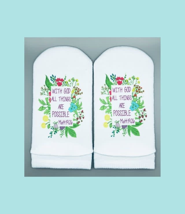 Women's white no-show sock with floral print on top and 'Matthew 19:26' verse printed on the sole.