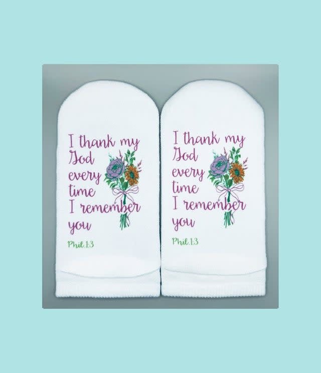 Women's white no-show sock with floral print on top and Philippians verse text printed on the sole.