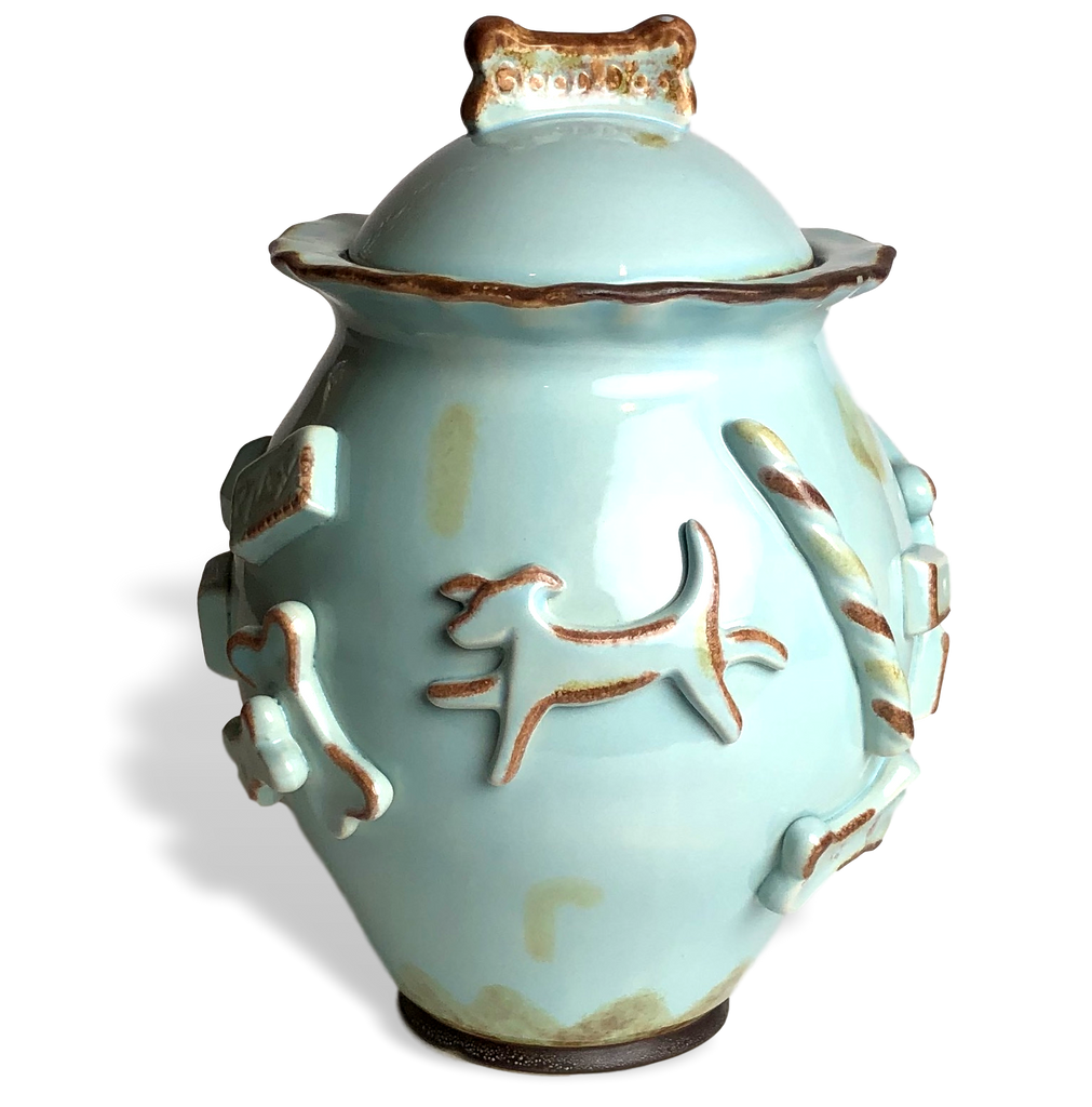 Hand-decorated ceramic dog treat jar with raised appliques and a Good Dog cookie silhouette on top.