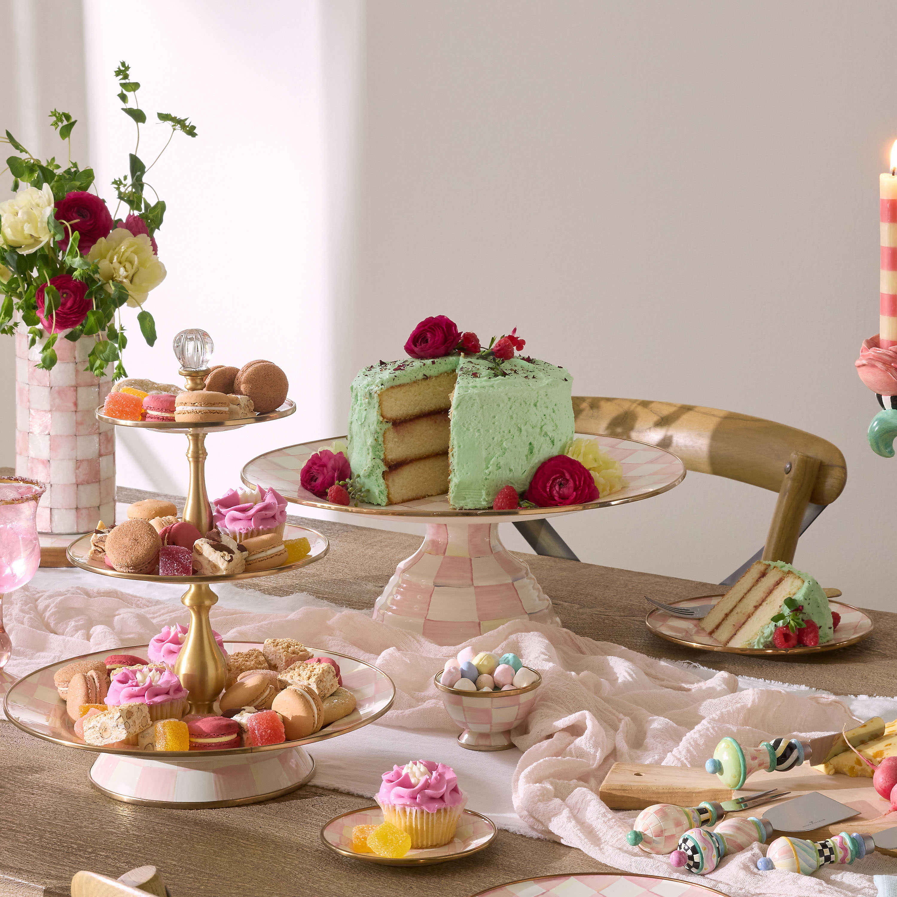 Rosy Check Large Pedestal Platter holding a green frosted cake on a table with other desserts.