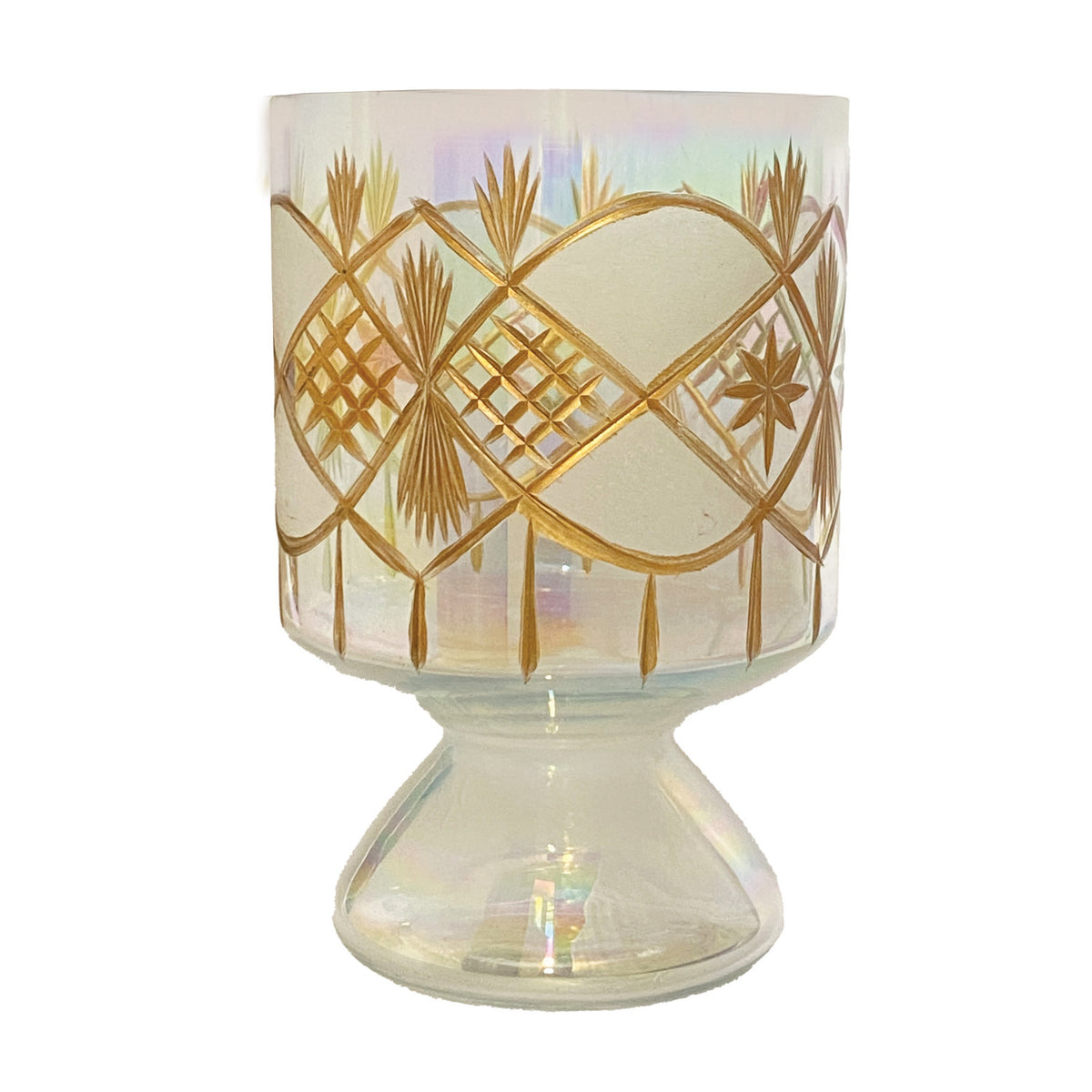 Iridescent hand-blown glass footed votive holder with etched gold geometric and star patterns.