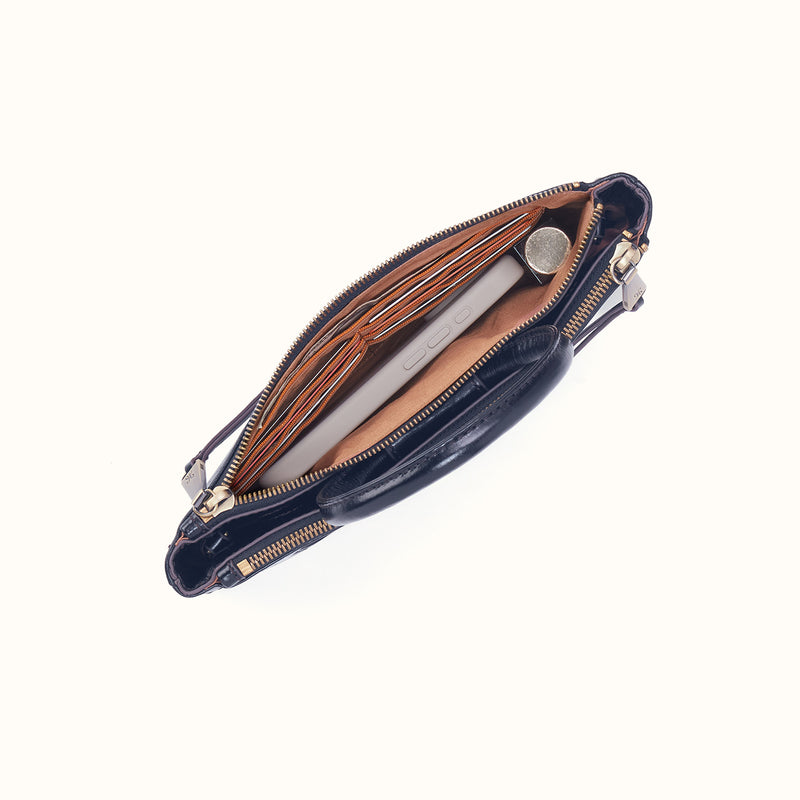 Interior view of the Sable Crossbody in Ink Navy showing card slots, a phone, and a lipstick.
