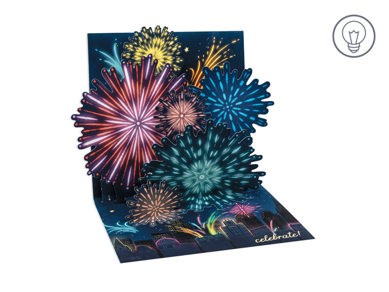 White envelope featuring a glowing fireworks display with clear fractured holographic foil finish.
