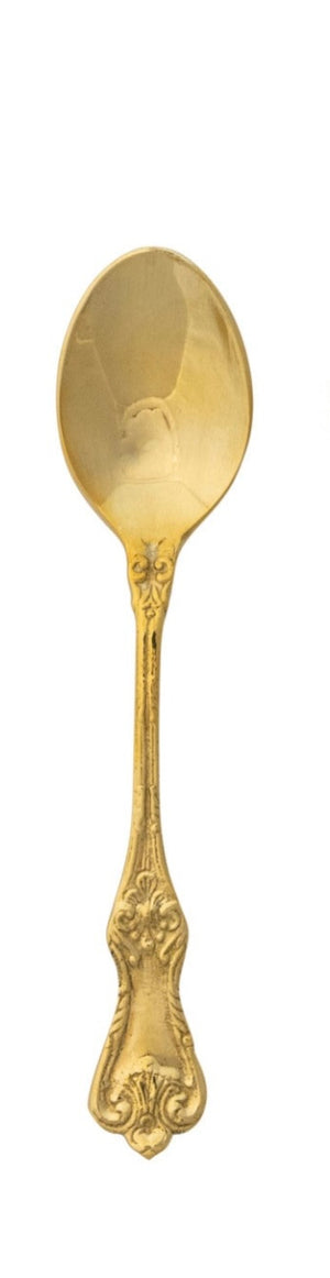 Embossed brass spoon with textured surface