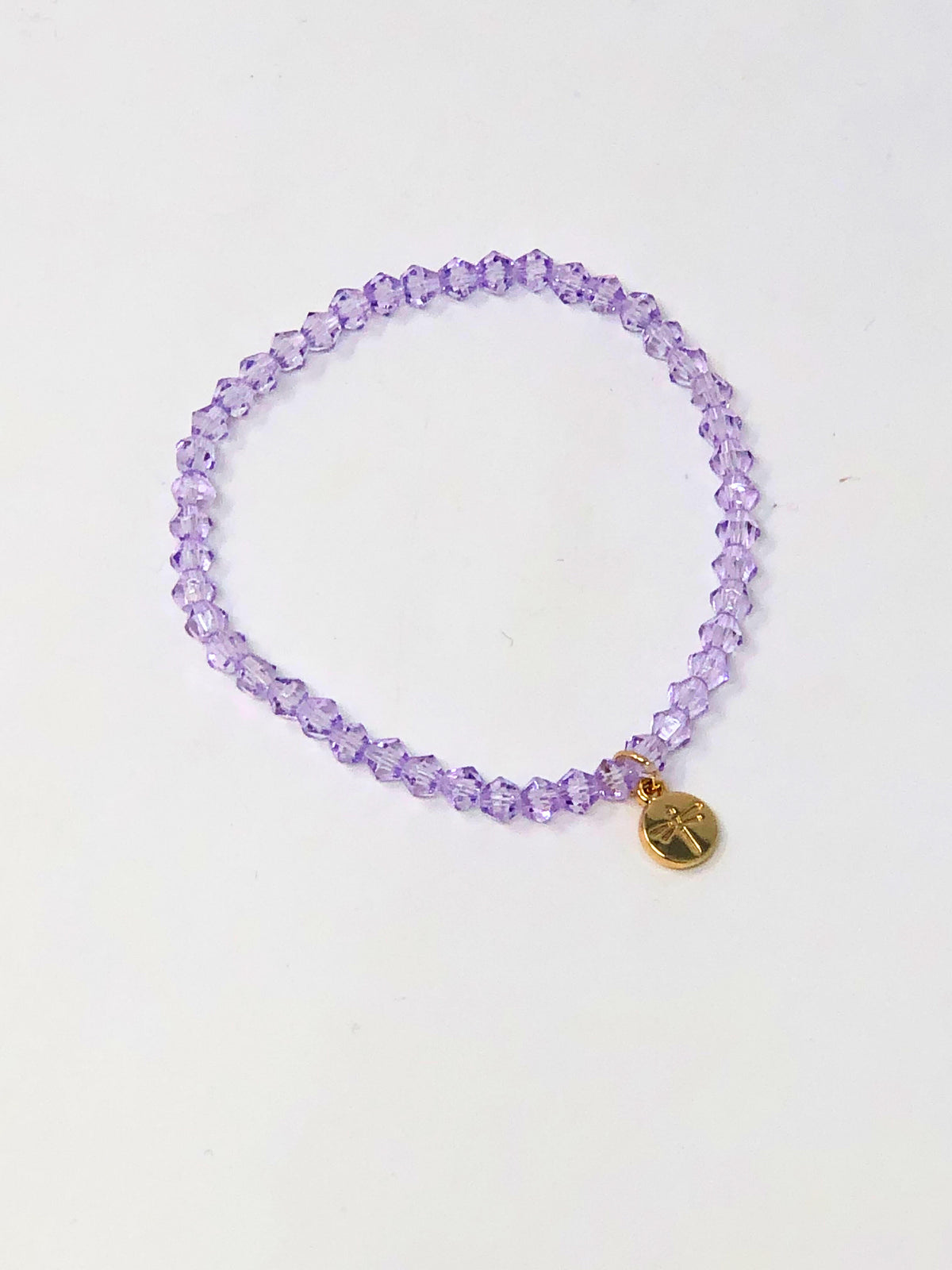 Stretchy bracelet with faceted glass beads in a colorful beaded pattern.