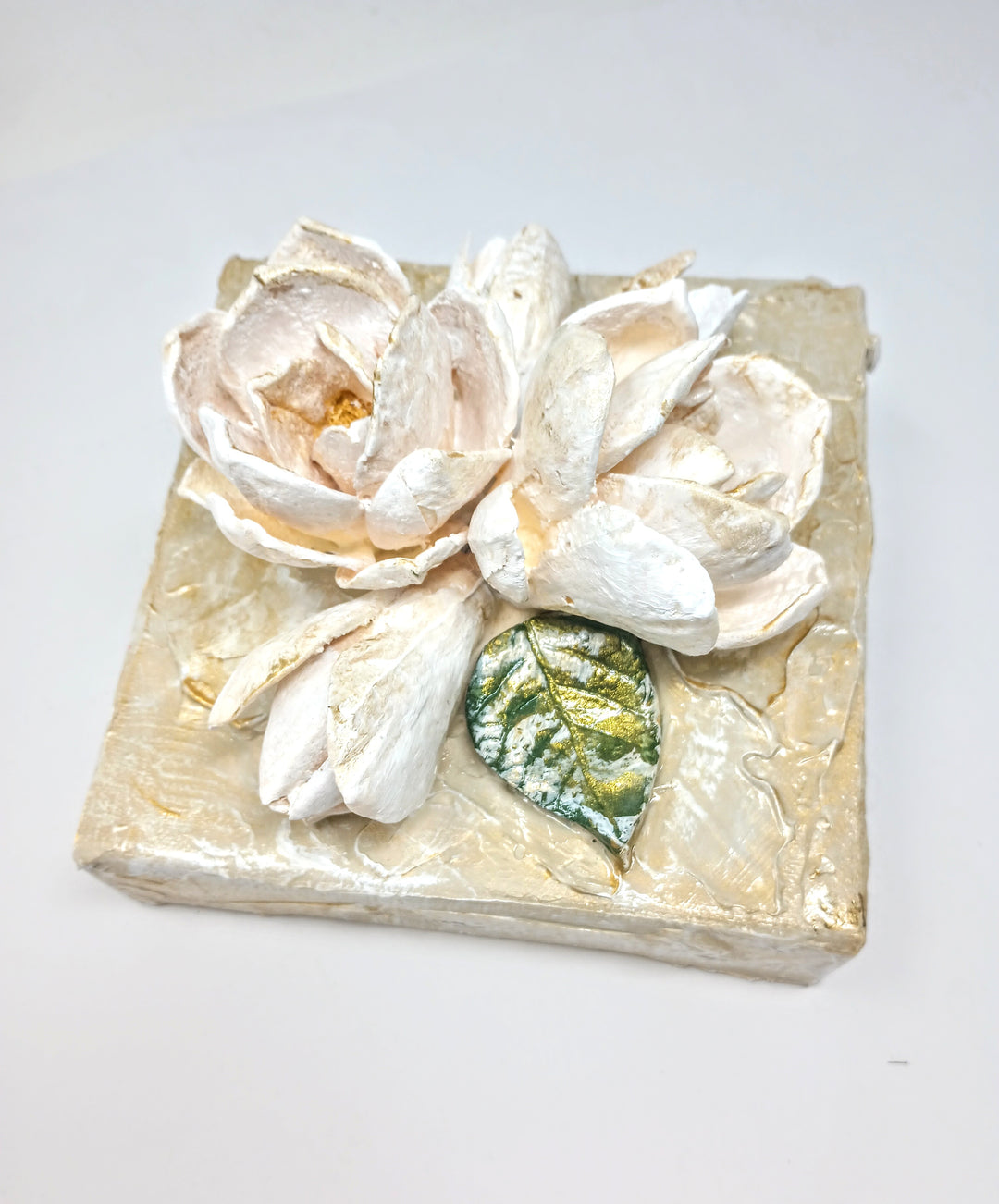6x6 inch square clay artwork featuring a floral bouquet relief pattern in earthy tones.
