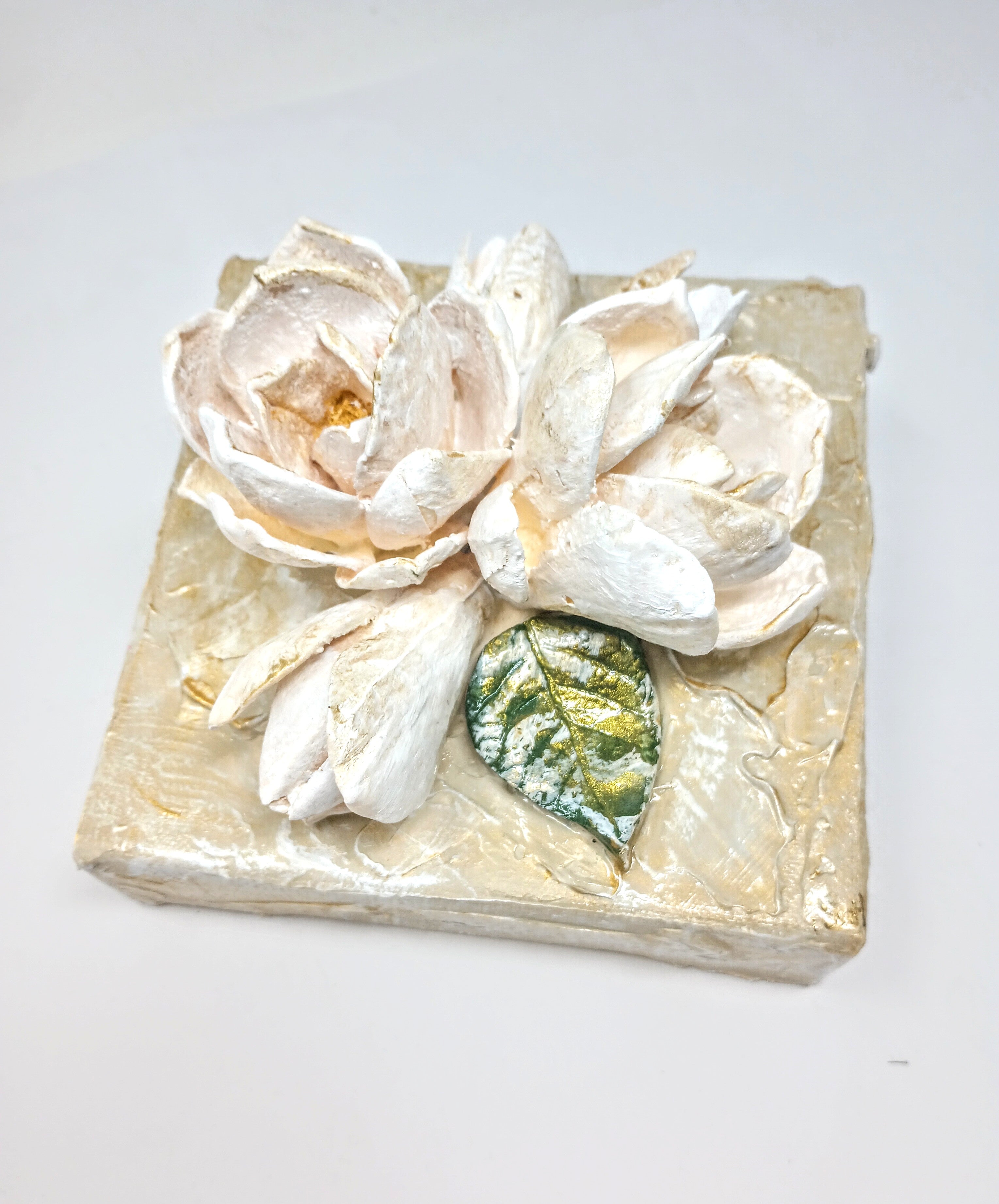 6x6 inch square clay artwork featuring a floral bouquet relief pattern in earthy tones.