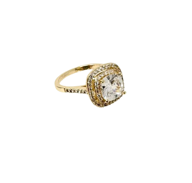 Gold-tone fashion statement ring with a cushion-cut center stone and double halo of small crystals.