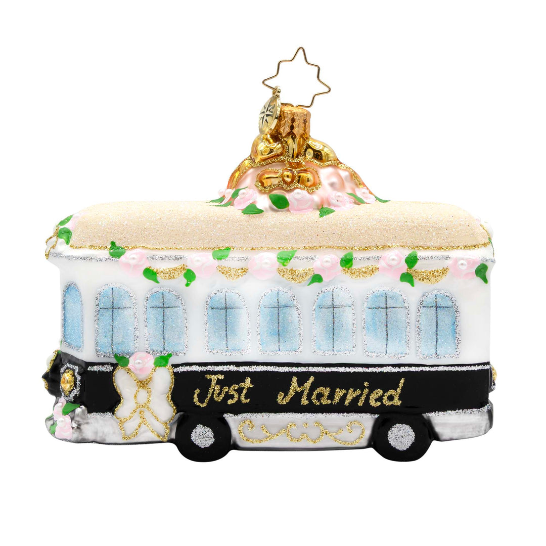 White and black glass trolley ornament with pink roses and gold 'Just Married' text.