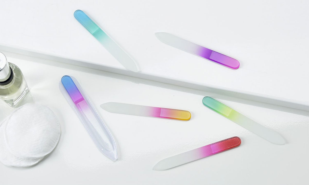 Transparent glass nail file with a rectangular shape.