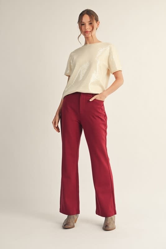 Sandy sequin sweater top with raw cut edge detail in a relaxed silhouette.