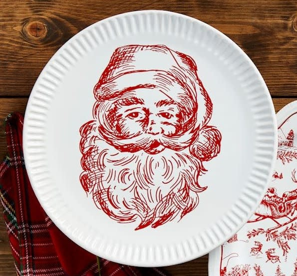 Small stoneware Santa Christmas platter with festive holiday character design.