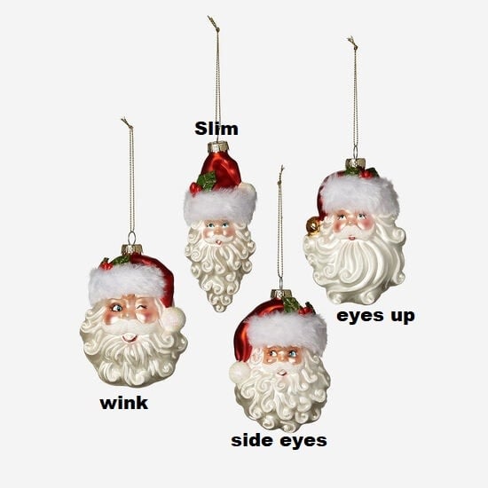 Glass Santa head ornament with red hat and white beard.