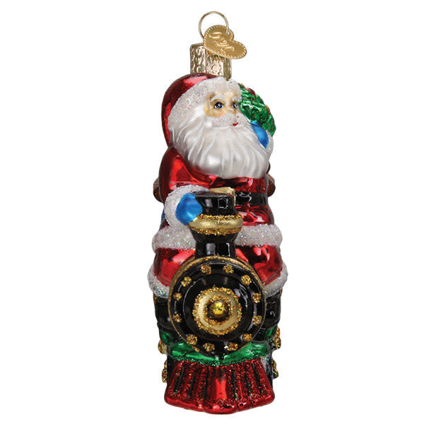 Red plastic Santa riding a green locomotive train ornament with gold wheels.