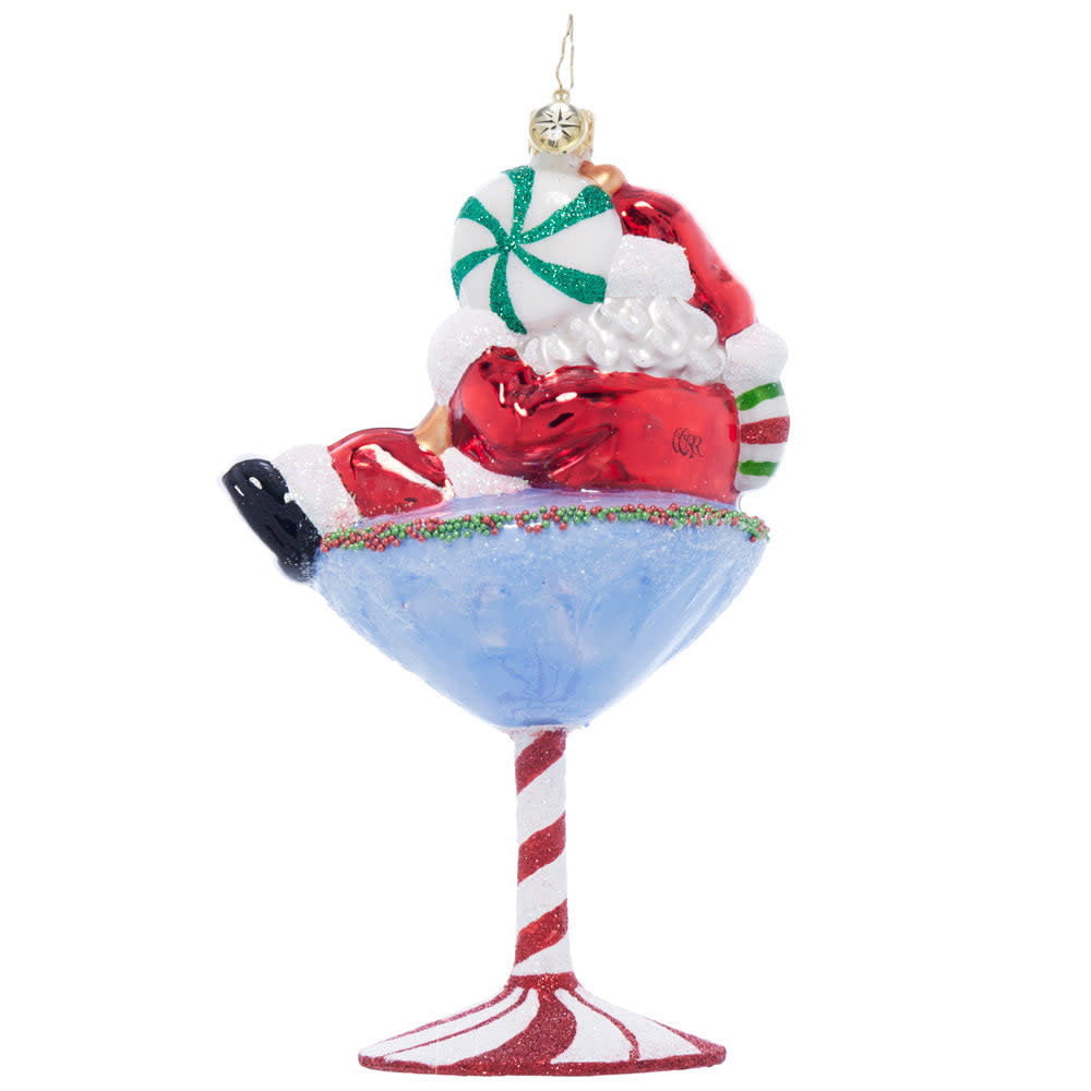 Back view of a Santa-Tini glass mug featuring red and white holiday patterns with reindeer motifs.