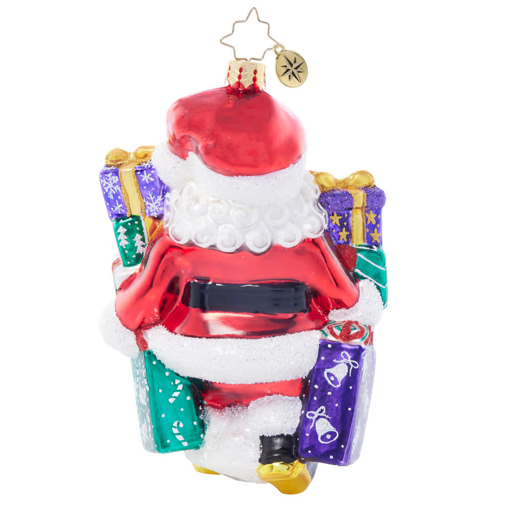 Back view of a Santa's Shopping Shenanigans ornament showing red fabric with white snowflake pattern and gold trim.