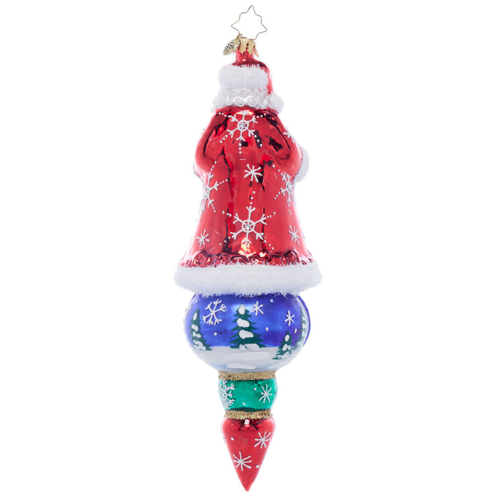 Back view of a Santa's Splendid Snowscape ornament featuring snowflake patterns on a dark background.