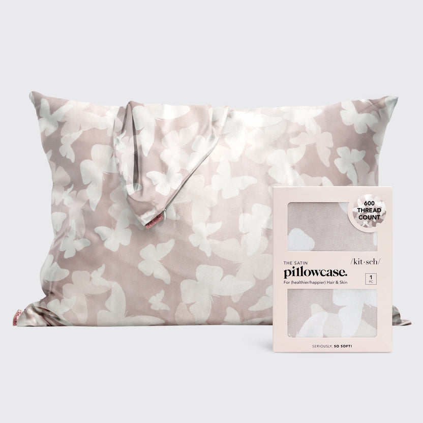Satin pillowcase in a soft neutral tone with a butterfly motif.