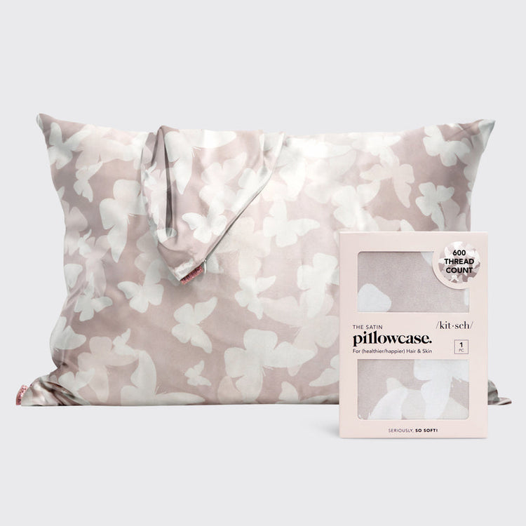 Satin pillowcase in a soft neutral tone with a butterfly motif.