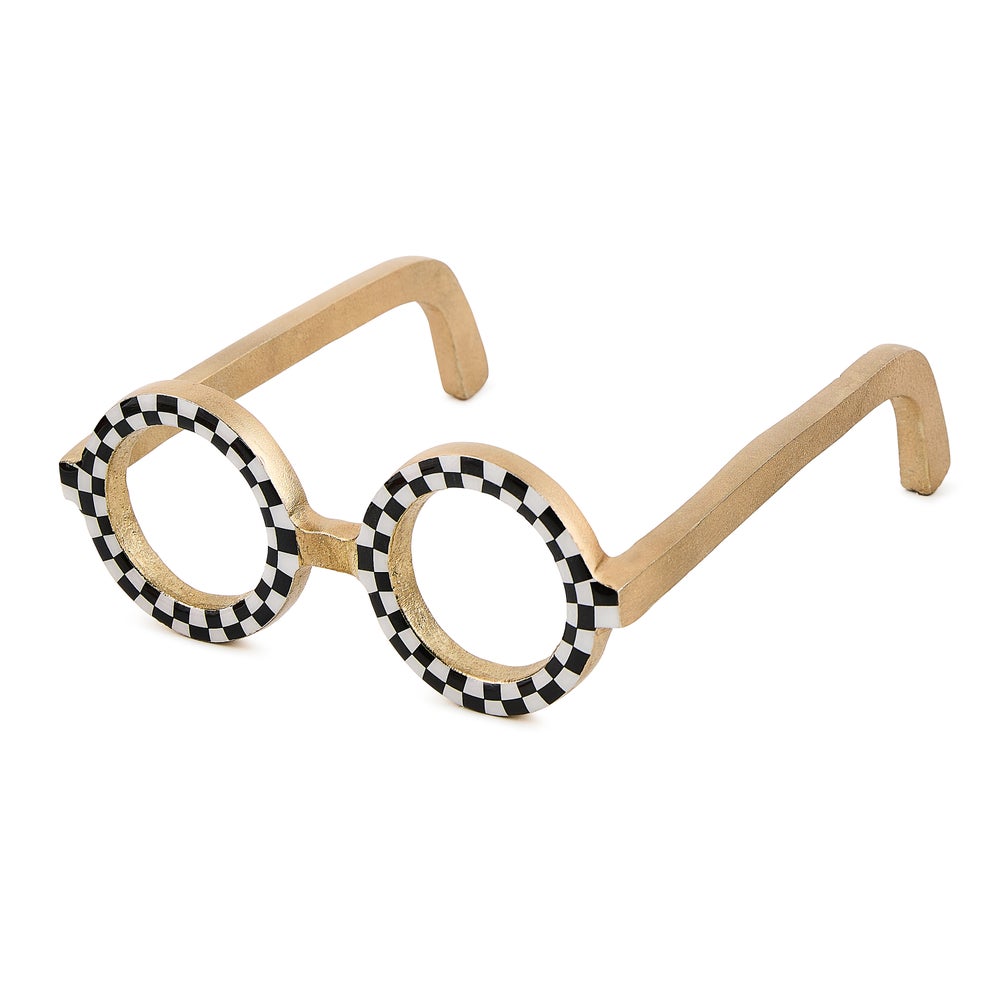Round gold aluminum glasses decor with black and white checkered patterns on the frames.