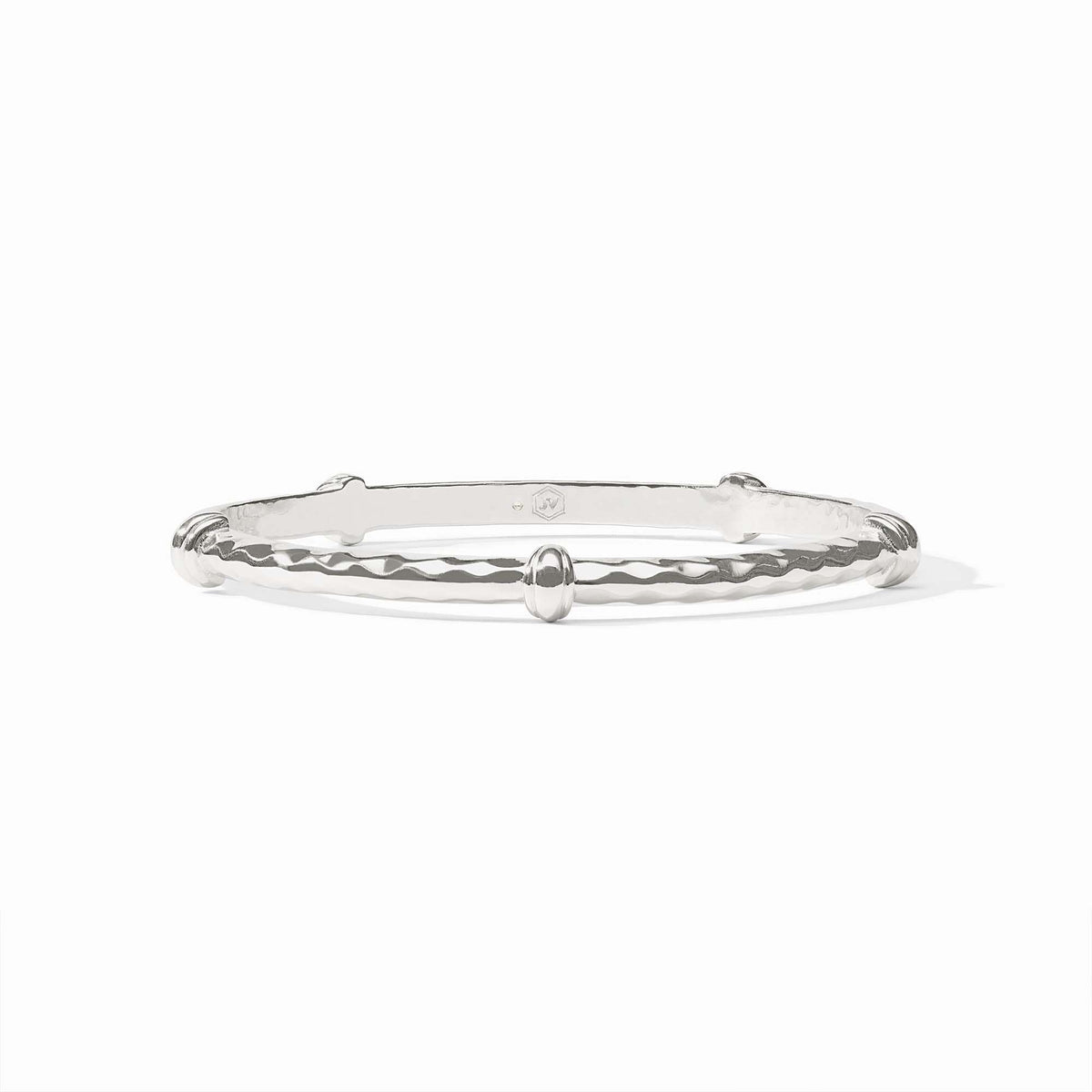 Silver Savannah bangle featuring diamond hammering texture and decorative stations.
