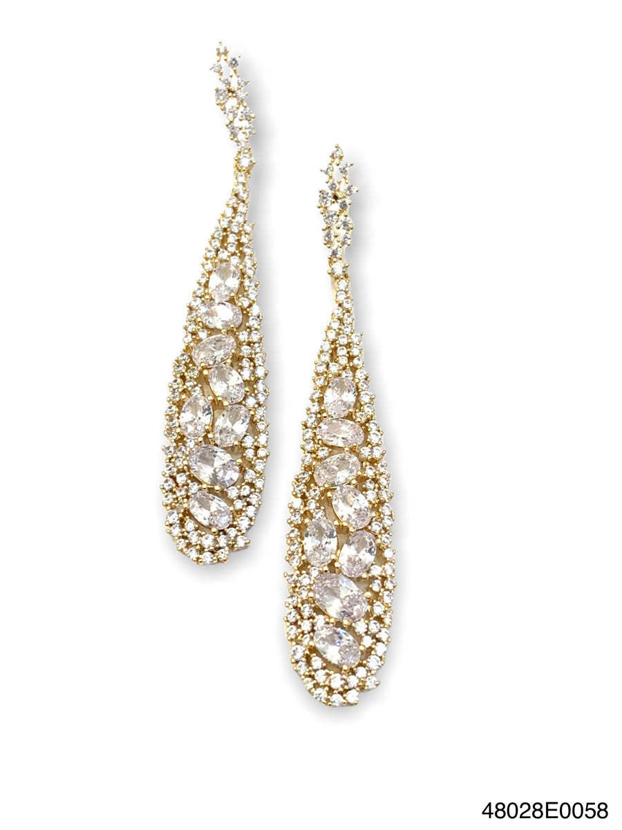 Gold Savannah statement drop earrings featuring hand-set cubic zirconia stones on a pierced post.