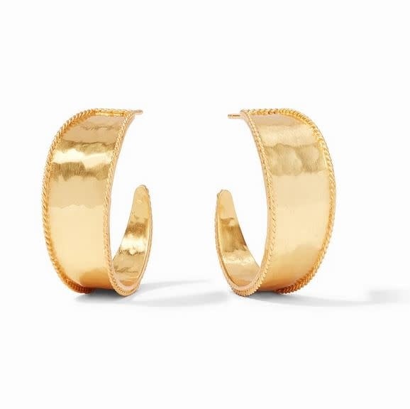 Lightly hammered gold hoop earring with twisted wire detail curving from wide to narrow.