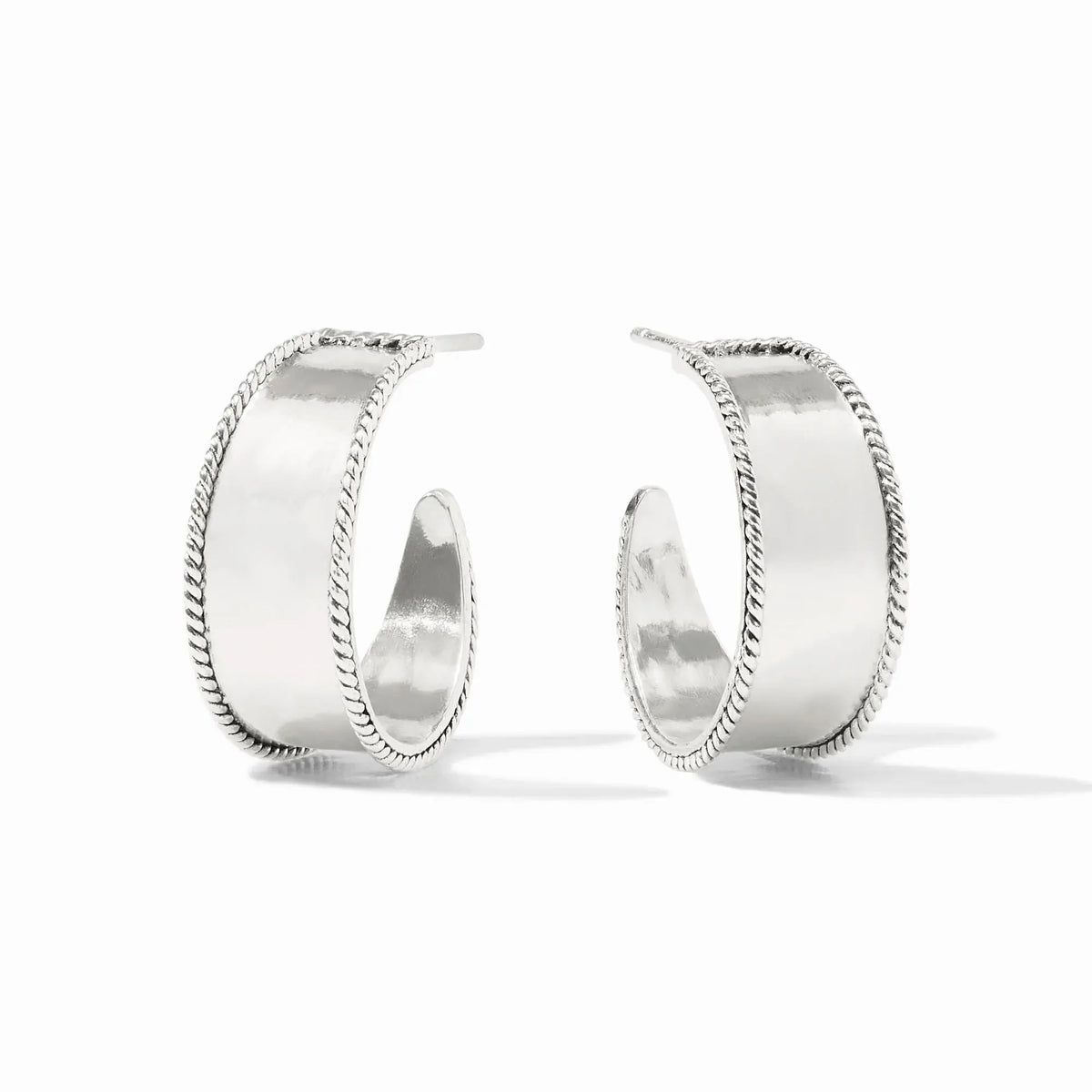 Small Savoy hoop earring in silver with hammered texture, twisted wire detail, and curved silhouette.