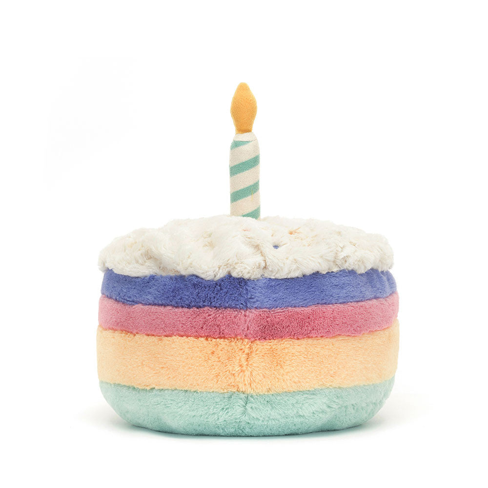 Amuseables Rainbow Birthday Cake plush toy with polyester fibers filling in rainbow pattern.