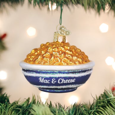 Glass Christmas ornament shaped like a blue bowl filled with glittery macaroni and cheese.