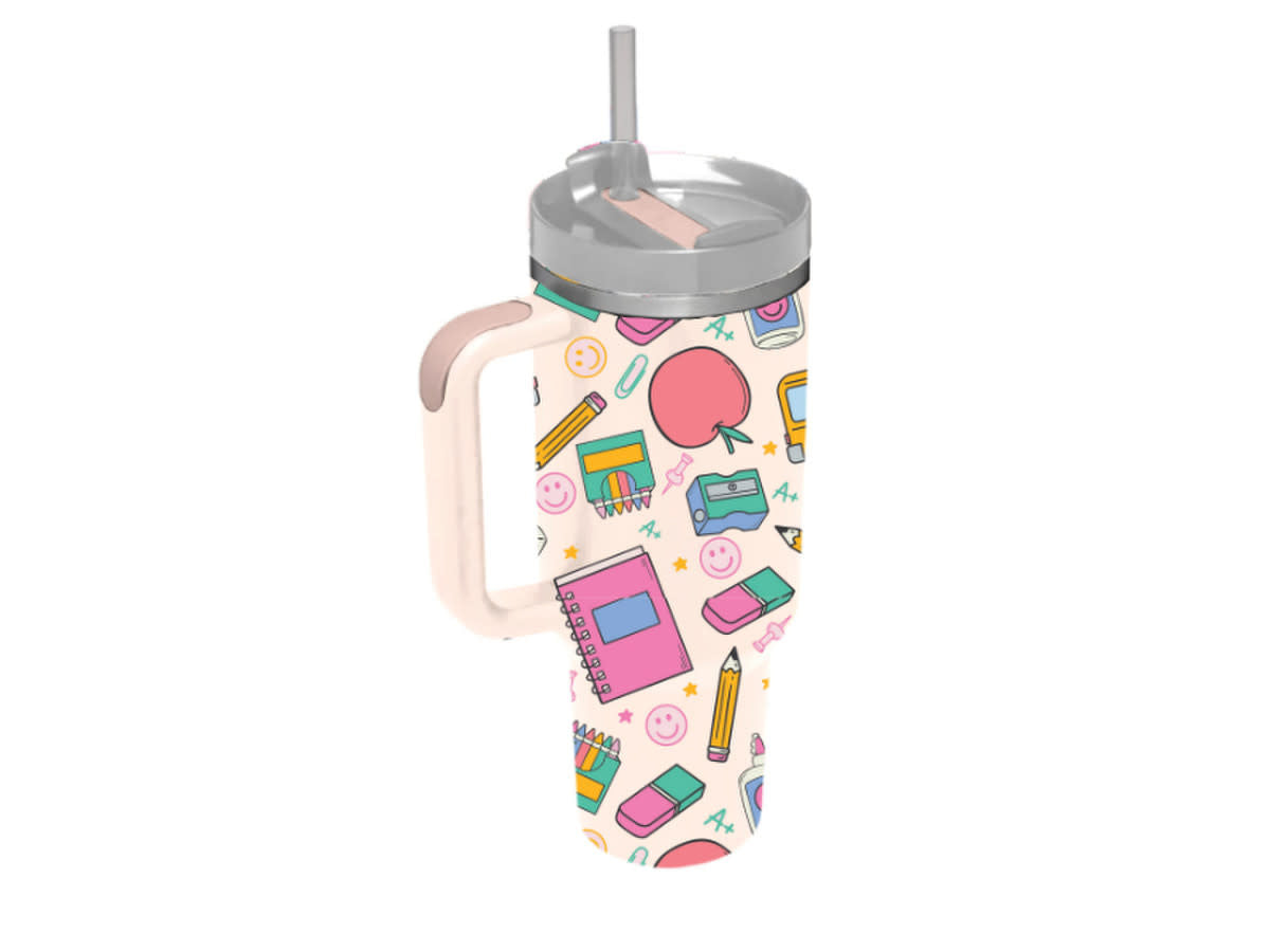 30 oz tumbler with handle and straw, featuring a light pink background with school supply pattern.