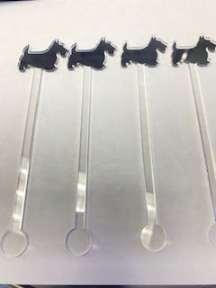 Scottie Stir Sticks in natural wood finish with a simple cylindrical shape.