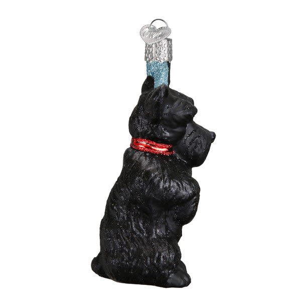 Side view of a Scottish Terrier ornament with black glossy finish standing on four legs.