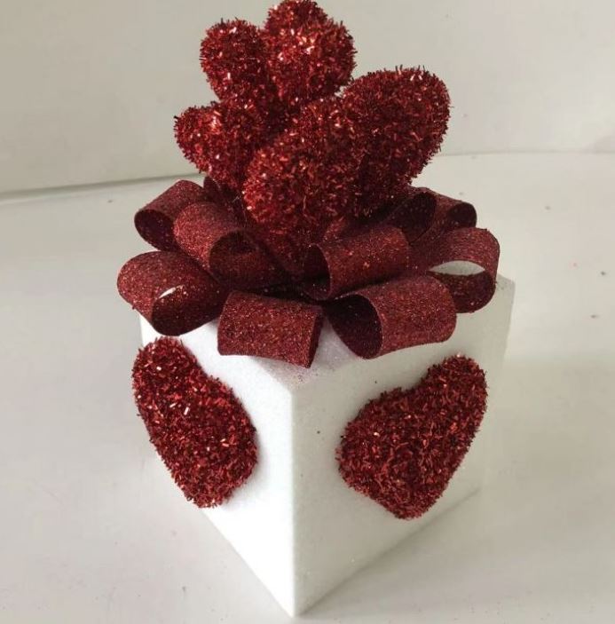 Square glitter gift box with heart patterns measuring 10.5 inches