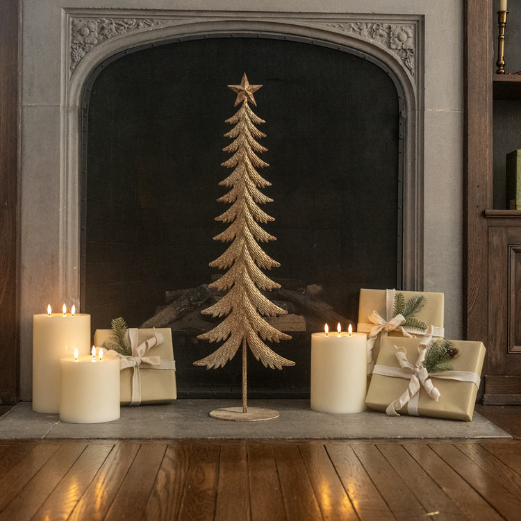 Gold metal tree decoration with a star topper