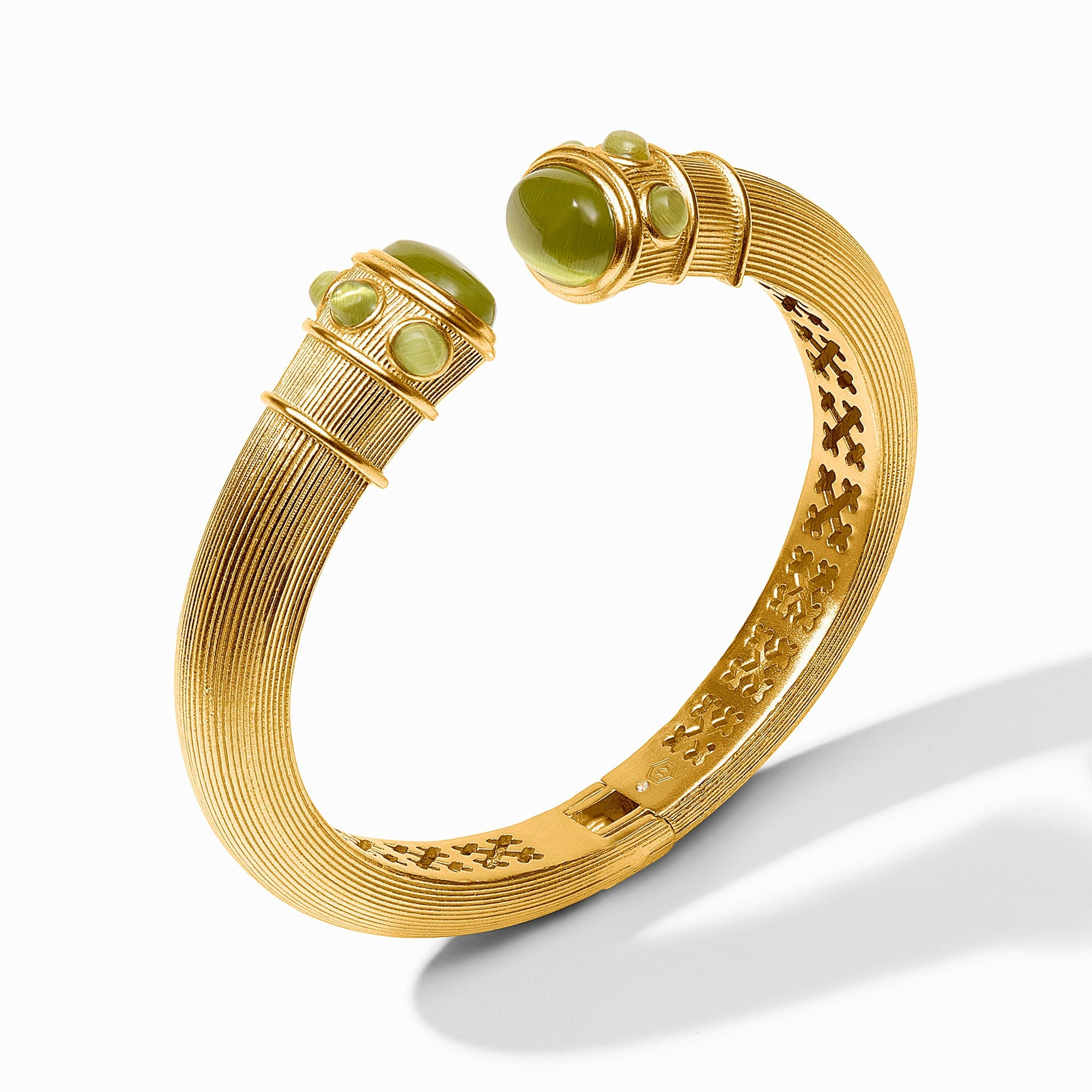 Gold-plated Cobblestone Demi Cuff with green glass cabochons and a textured, ribbed design.