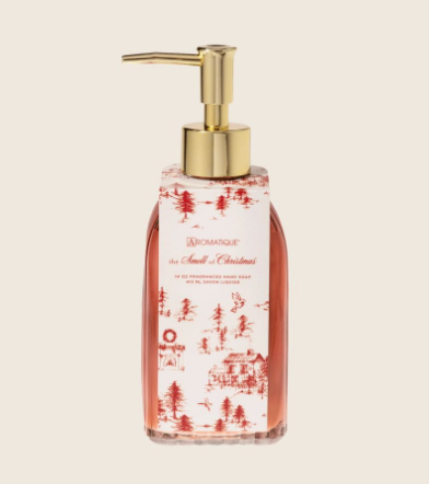 Gilded liquid hand soap in a gold glass bottle with clove, orange, and cinnamon scents.