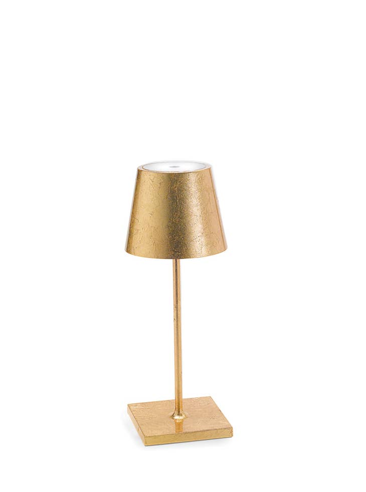 Gold leaf die-cast aluminum cordless table lamp with square base and polycarbonate diffuser.