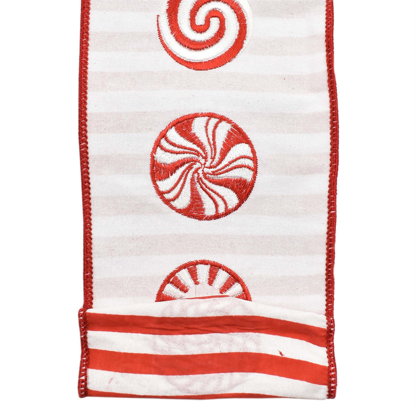 Red candy ribbon with white peppermint swirls on striped backing