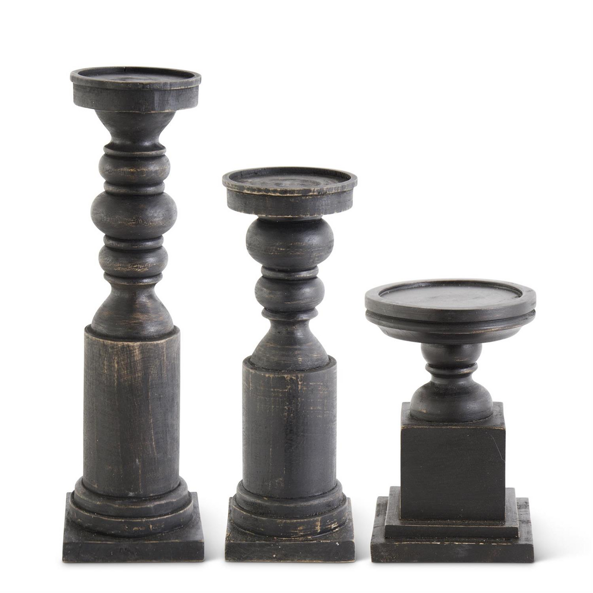 Set of three black wood candleholders with square bases in varying heights and distressed finish.