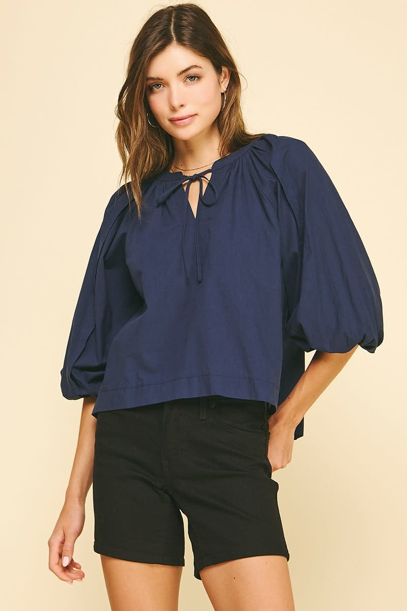 Navy cotton self-tie V-neck blouse with balloon sleeves