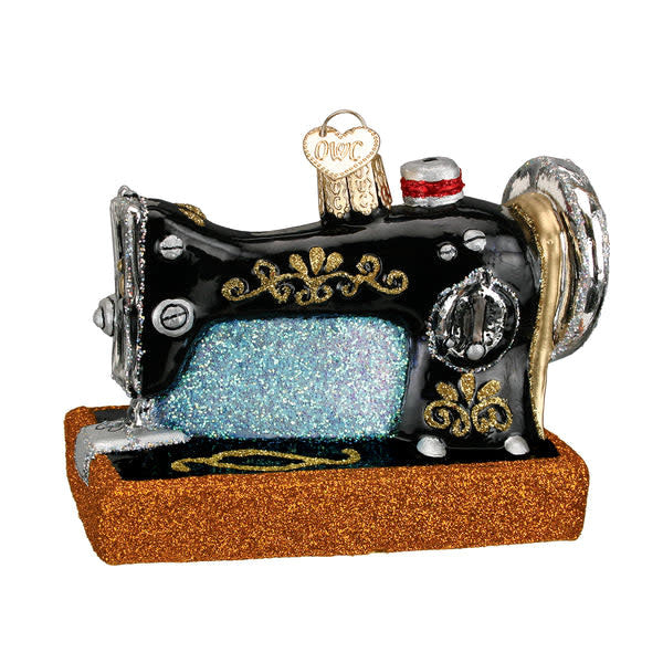 Sewing Machine Ornament in antique brass finish with detailed needle mechanism silhouette