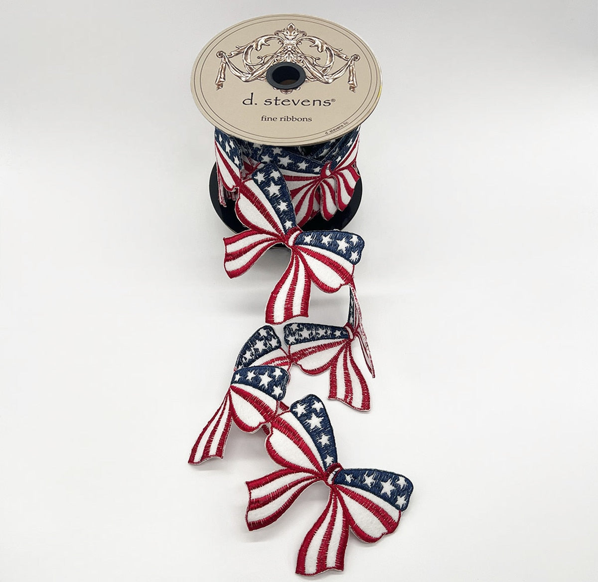 Red felt Americana bow garland with white and blue embroidered ribbon accents.