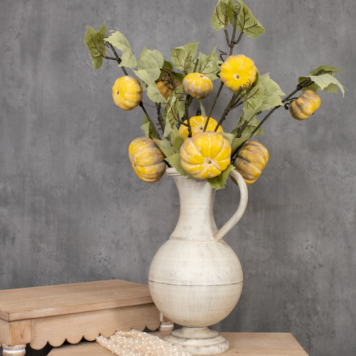Artificial green pumpkin vine with natural-looking leaves on a flexible stem.