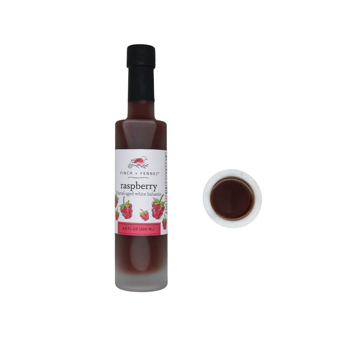 6.8 oz bottle of raspberry barrel aged white balsamic vinegar with a clear glass silhouette and red label.