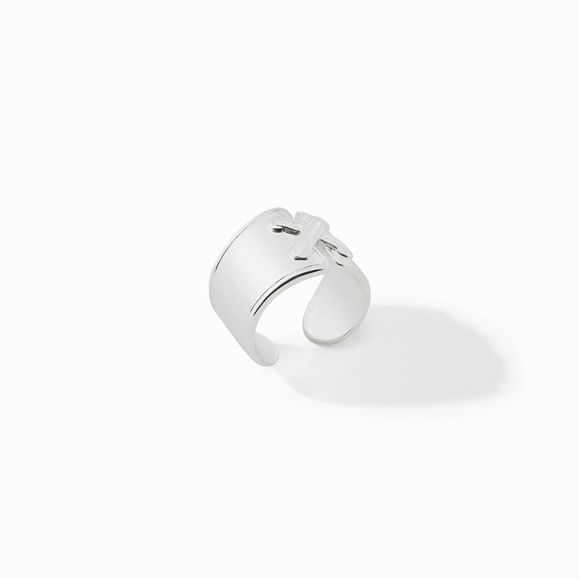 Essex Ring in polished silver with a wide, adjustable band and a decorative cross detail.