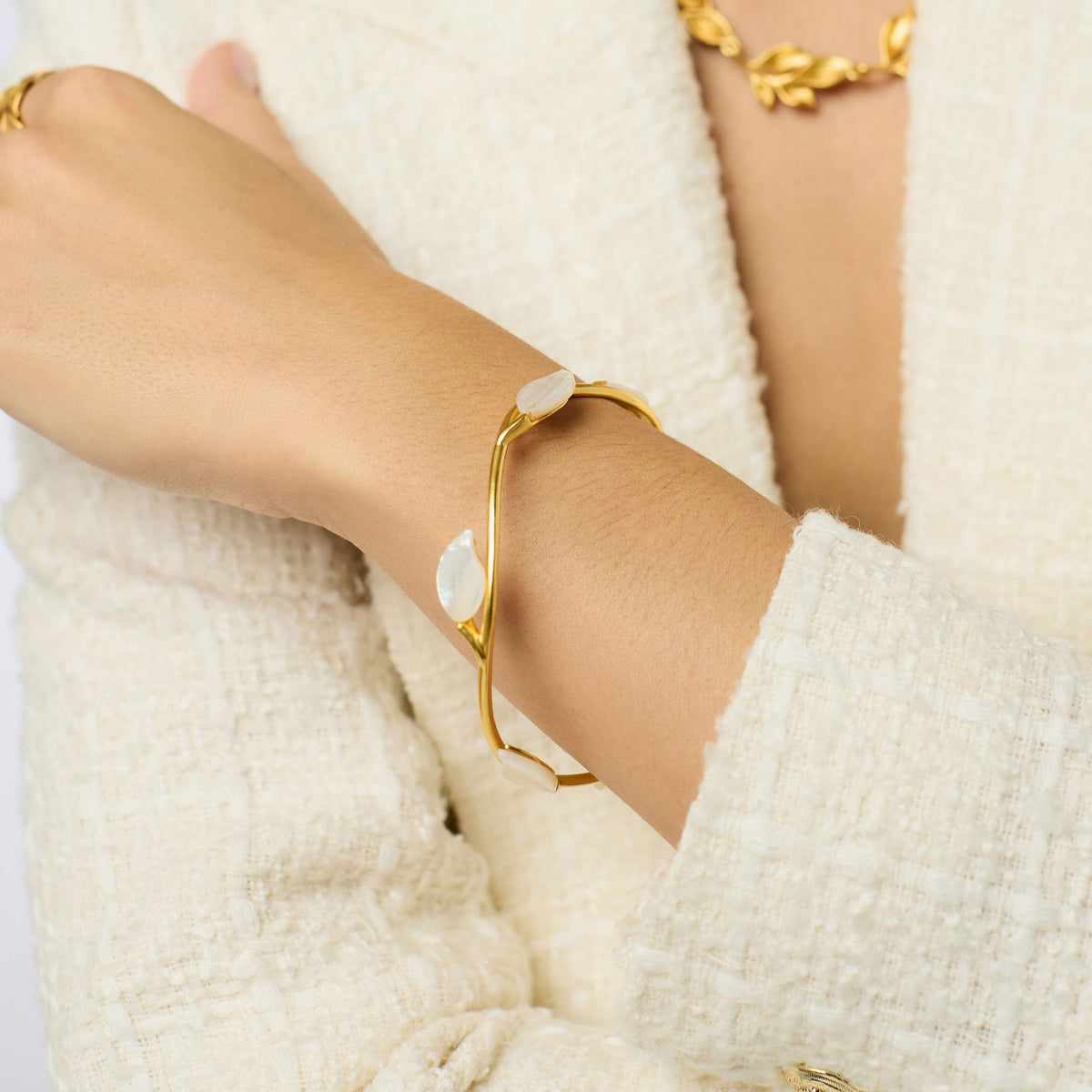 Willow Stone bangle bracelet with a smooth oval stone in earthy tones set on a polished silver band.