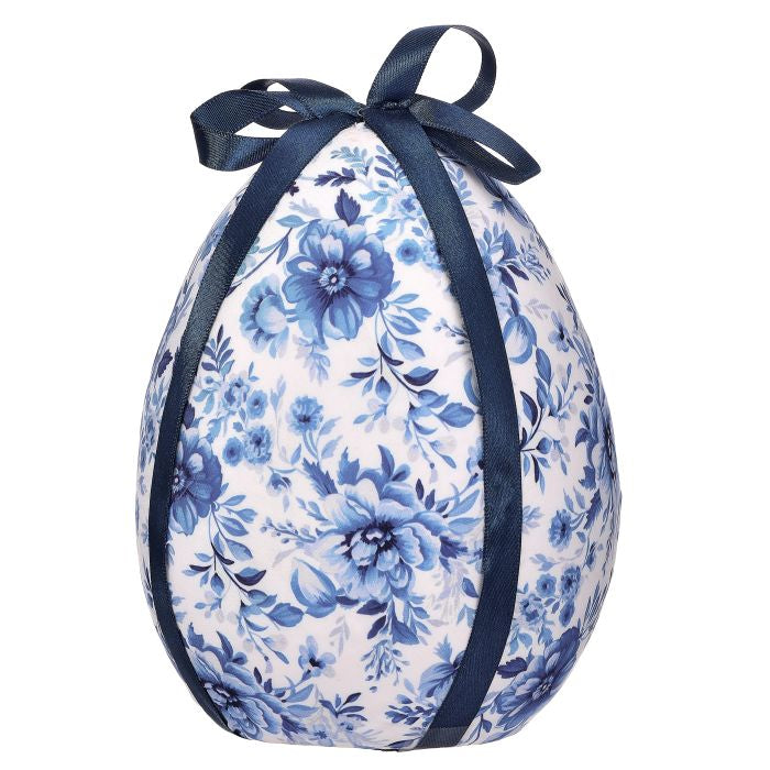 Blue white fabric egg wrapped in traditional toile floral botanical illustration with a bow